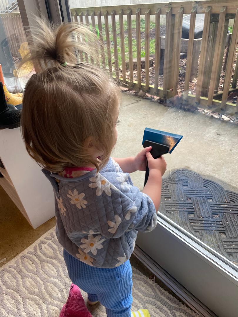 Child using squeegee tool